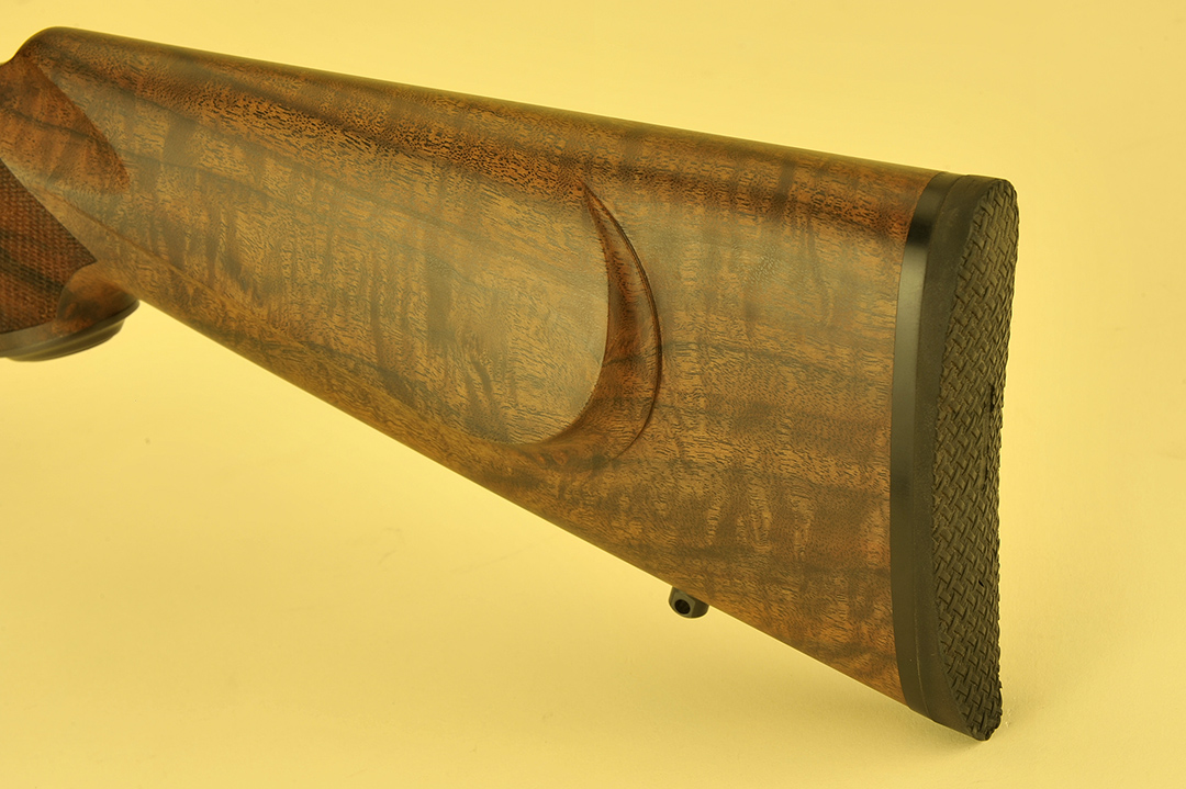 This Classic Custom follows the tradition of a fine stock having a straight stock sans Monte Carlo hump, and for an addition to the gun, a shadow line was ordered. The rubber Pachmayr pad is standard and since it is only a .22 caliber, a thin pad was installed.